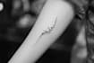 create arabic and persian minimal calligraphy tattoo