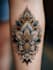 create a dark art style custom tattoo design