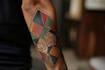 create sleeve tattoo design in geometric style