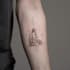 create a small, minimalistic, fine line spiritual tattoo