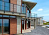 render coastal modern villa,timber cladding,rooftop solar panel,concrete facades