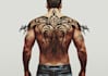 design half back tribal tattoo with authentic pattern