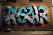 paint real graffiti art on the street wall