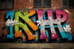 paint real graffiti art on the street wall