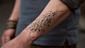 design unique handdrawn persian arabic calligraphy tattoo