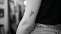 design a minimalist fine line tattoo