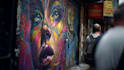 paint real graffiti art on the street wall