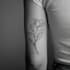 create a small, minimalistic, fine line spiritual tattoo