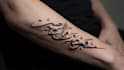 create arabic and persian minimal calligraphy tattoo