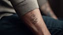 create arabic and persian minimal calligraphy tattoo