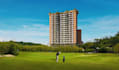 design high rise building,putting green,golf course backyard,cgi front elevation