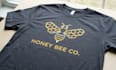 create modern honey bee logo t shirt design