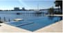 create a 3d swimming pool design with lighting and spillover details