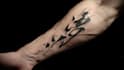 create arabic and persian minimal calligraphy tattoo