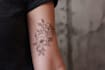 create a cute minimalistic line art tattoo design
