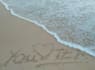 write your message creatively on a beach as  video or photo
