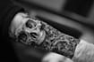 make a realistic black and white tattoo design for you