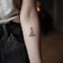 create a small, minimalistic, fine line spiritual tattoo