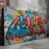 paint real graffiti art on the street wall