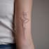 create a small, minimalistic, fine line spiritual tattoo