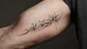 create arabic and persian minimal calligraphy tattoo