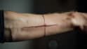 create arabic and persian minimal calligraphy tattoo