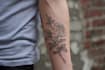 create a cute minimalistic line art tattoo design