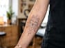 do black and white geometric custom tattoo, monoline logo