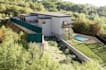 build 3d modern forest house,stone facade, elevated deck, retaining wall,cgi art