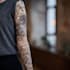 create a detailed custom full sleeve tattoo design