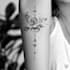 create delicate fine line flower tattoos