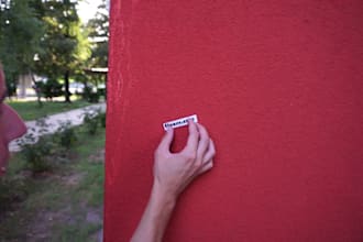 run and glue your sticker to a wall