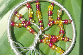 send you this sterling plated Autumn tree pendent