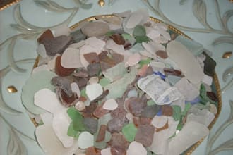 take a picture of a name written in seaglass in the sand