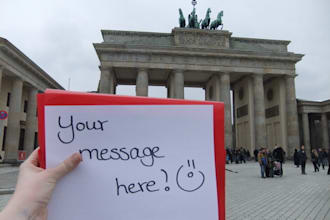 take a picture with your message in front of the Brandenburger Tor in Berlin