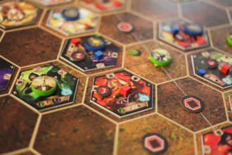 teach and coach you to become a board game designer and developer