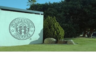 draw your Logo or message with charcoal on a brick wall