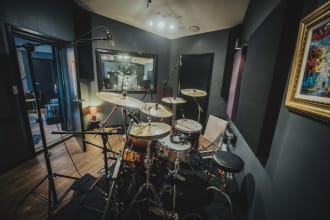 provide bass guitar and real drum tracks for your country songs