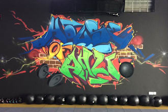 paint real graffiti art on the street wall
