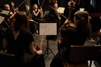 compose or arrange for orchestra, choir or small ensemble