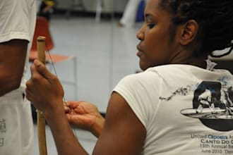 create an instructional video for playing berimbau
