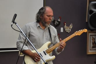teach you to play guitar or bass
