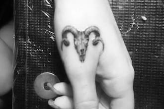 design a custom hand tattoo with experience as tattoo artist