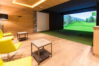 indoor golf simulator lounge, swing, golfzon, skytrak, golf clubs, tv, projector