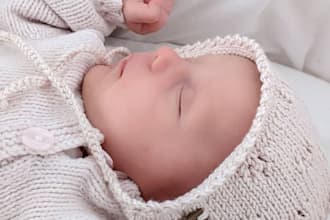 knit handmade baby hat or bonnet from natural wool