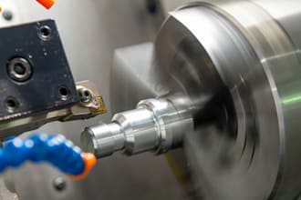 design manufacturable cnc part for machining including shafts, bushings, fitting