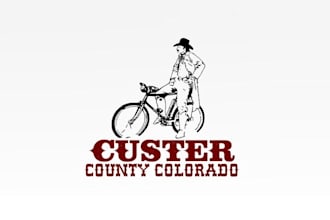make custer county tourism biking cowboy logo