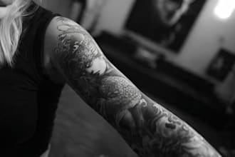 make a realistic black and white tattoo design for you