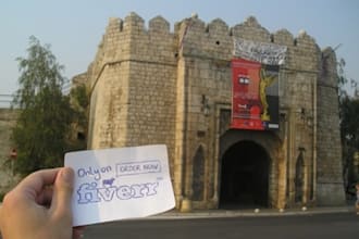 take pictures of the Ottoman fortress while holding your message