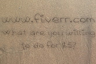 make HD Video of a sea wave reveal your message on sand